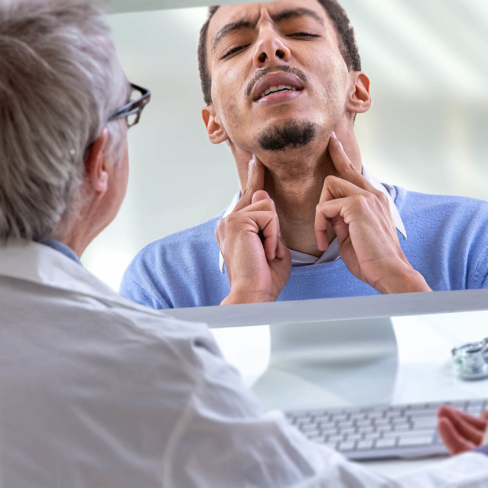 telemedicine-image doctor using computer to deliver telehealth to symptomatic patient