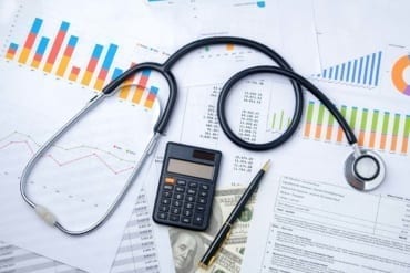 Stethoscope with Pen, Charts and Graphs, Finance, Account, Statistics, Investment, Analytic Research Data, Medical and Insurances Concept
