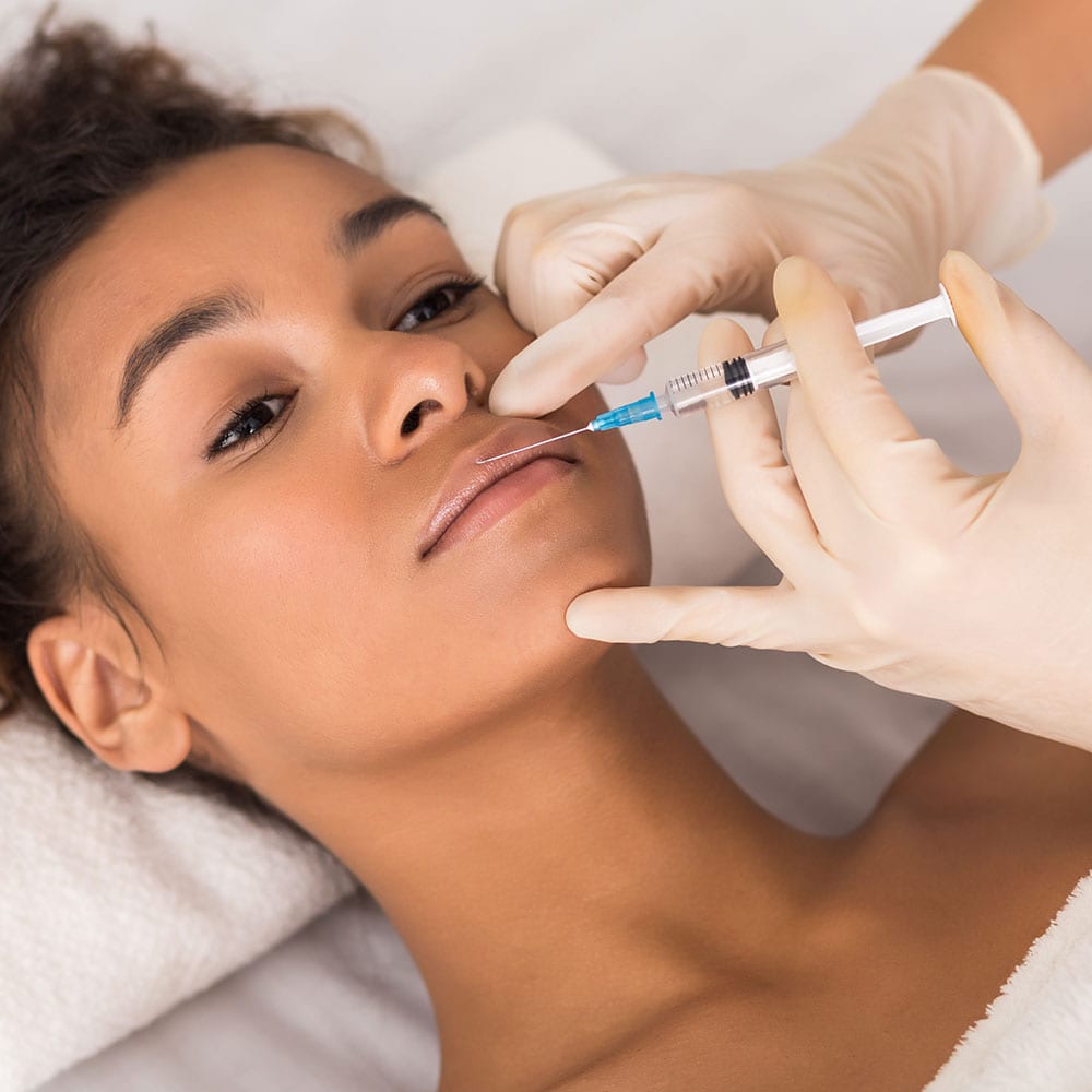 A Female Lip Filler Patient Getting Treatment At A Medspa Covered By Medical Malpractice Insurance