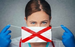 A Female Doctor With Medical Malpractice Insurance Putting On A Surgical Mask With The Alabama State Flag On It