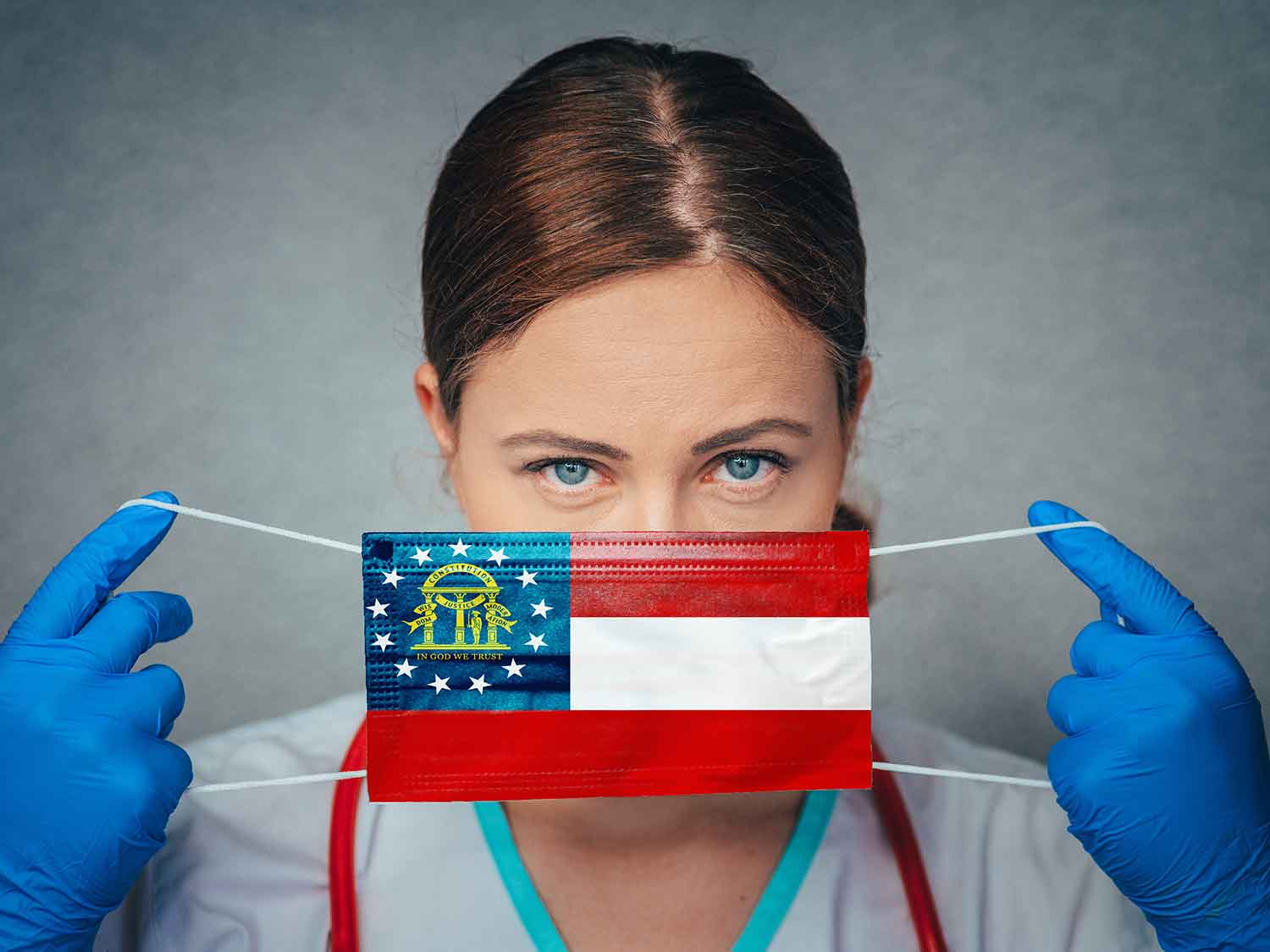 A Female OB/Gyn With A Medical Malpractice Insurance Policy Covering Her Face With A Georgia State Flag Mask