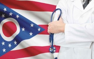 A Medical Practitioner With Malpractice Coverage Standing In Front Of The Ohio Flag