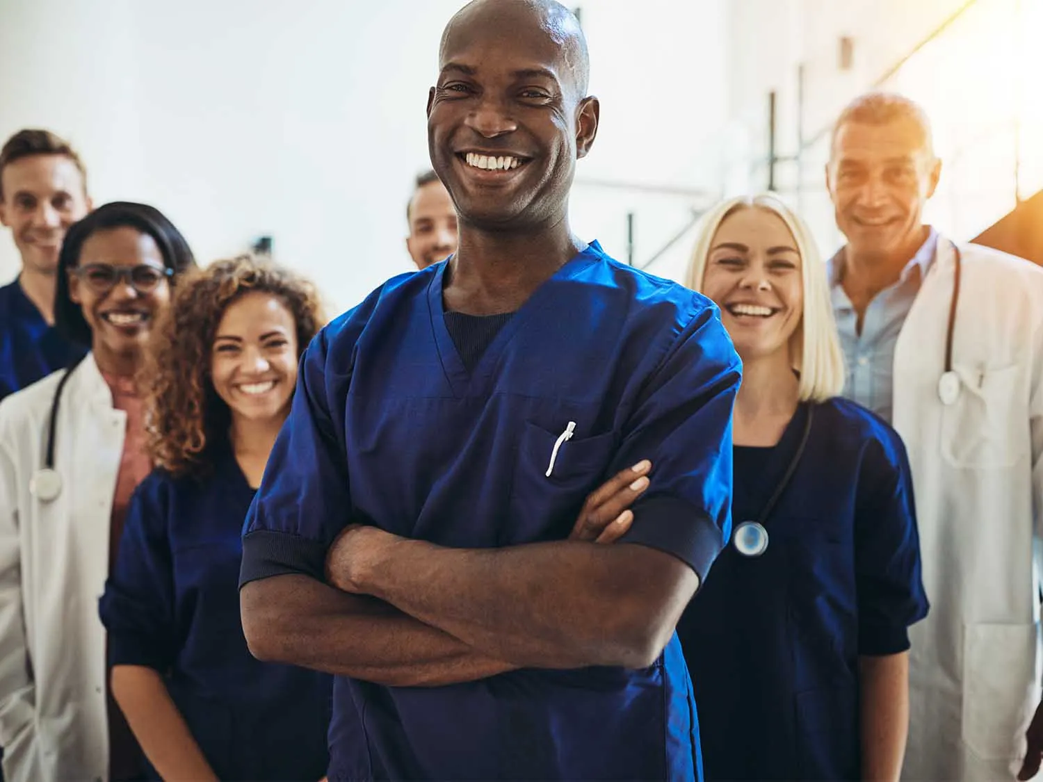 A Variety Of Medical Professionals Smiling With Medical Malpractice Insurance Policies From MEDPLI
