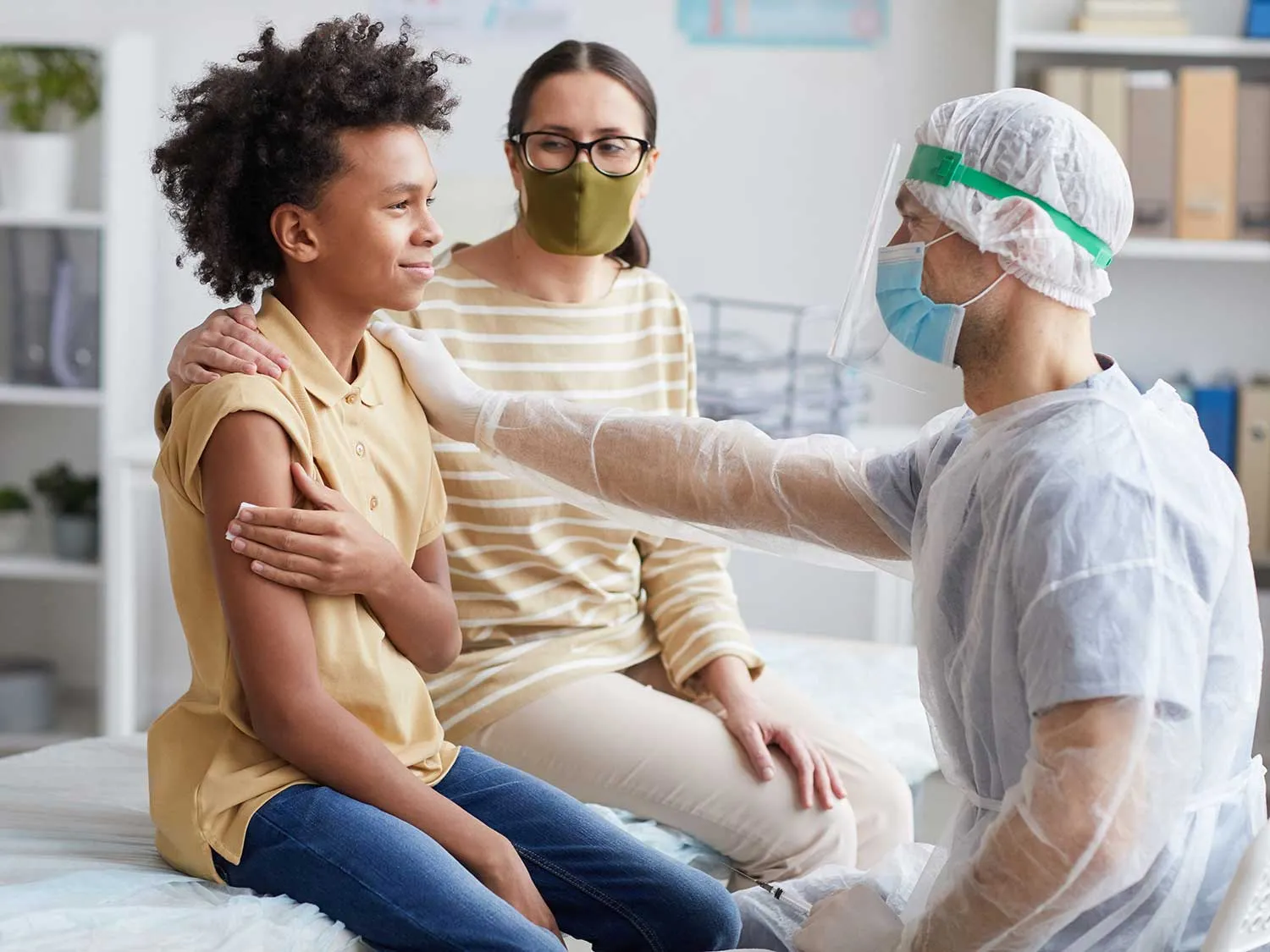 A Family Medicine Physician With Medical Liability Coverage Caring From A Young Boy And His Mother