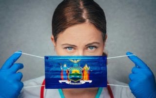 A Female Doctor With Medical Malpractice Insurance Putting On A Surgical Mask Printed With The New York State Flag