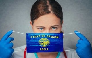 A Female Physician With Medical Malpractice Insurance Holding A Oregon State Flag Surgical Mask Over Her Face