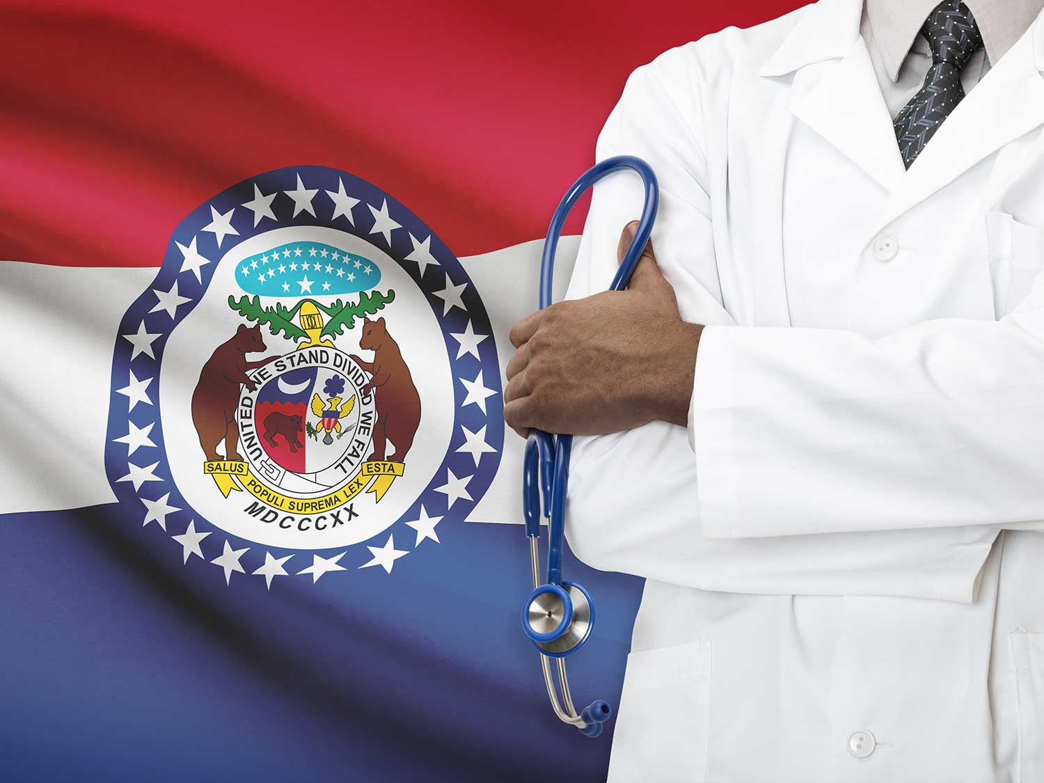 Doctor With Medical Malpractice Insurance Standing In Front Of Missouri State Flag Holding A Stethoscope