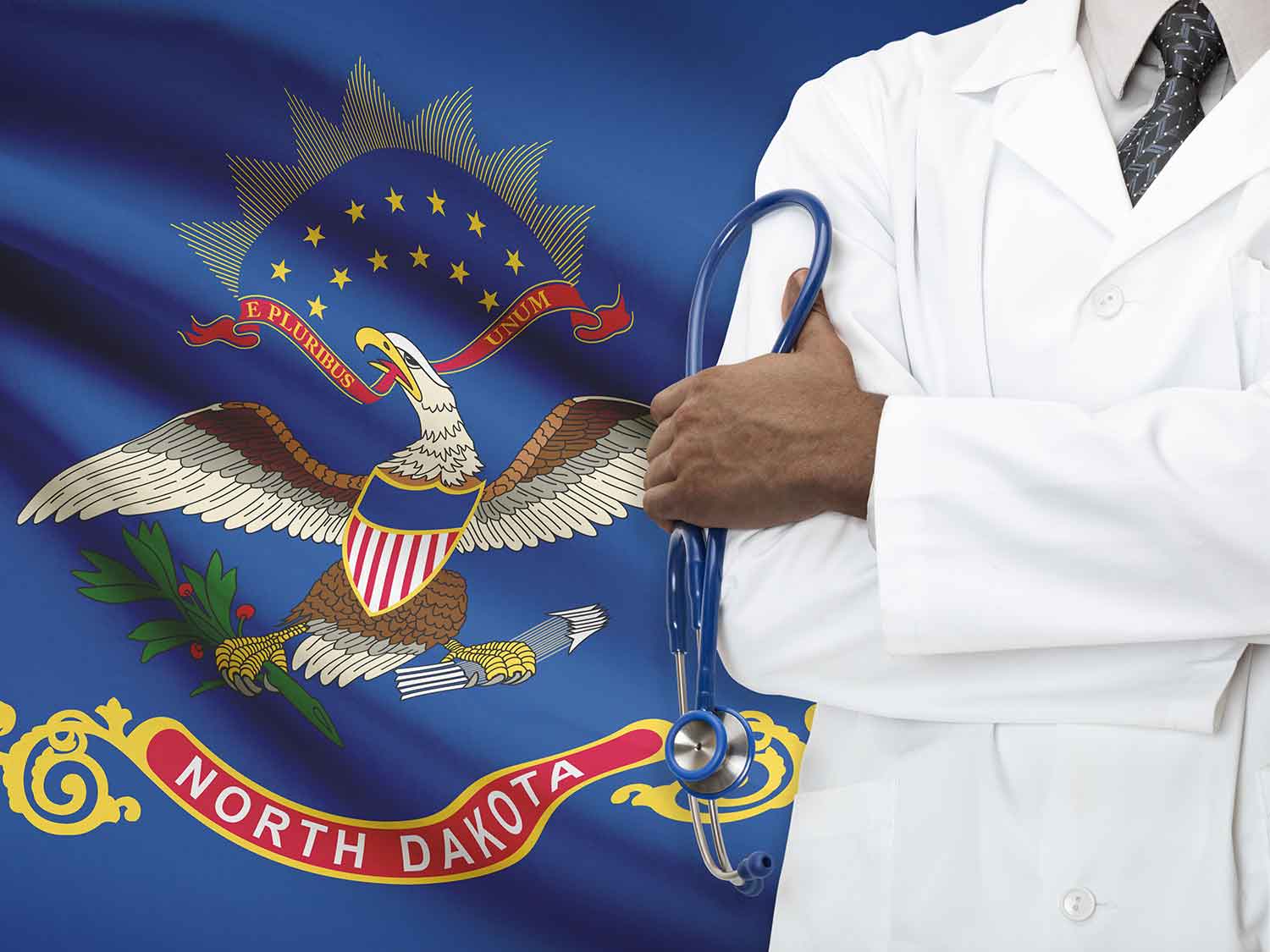 North Dakota Doctor With Medical Malpractice Insurance Standing In Front Of The State Flag